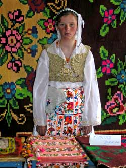 Florina Bresa sells carpets and other handicrafts at a craft fair and exhibition in Caje, near Kukes